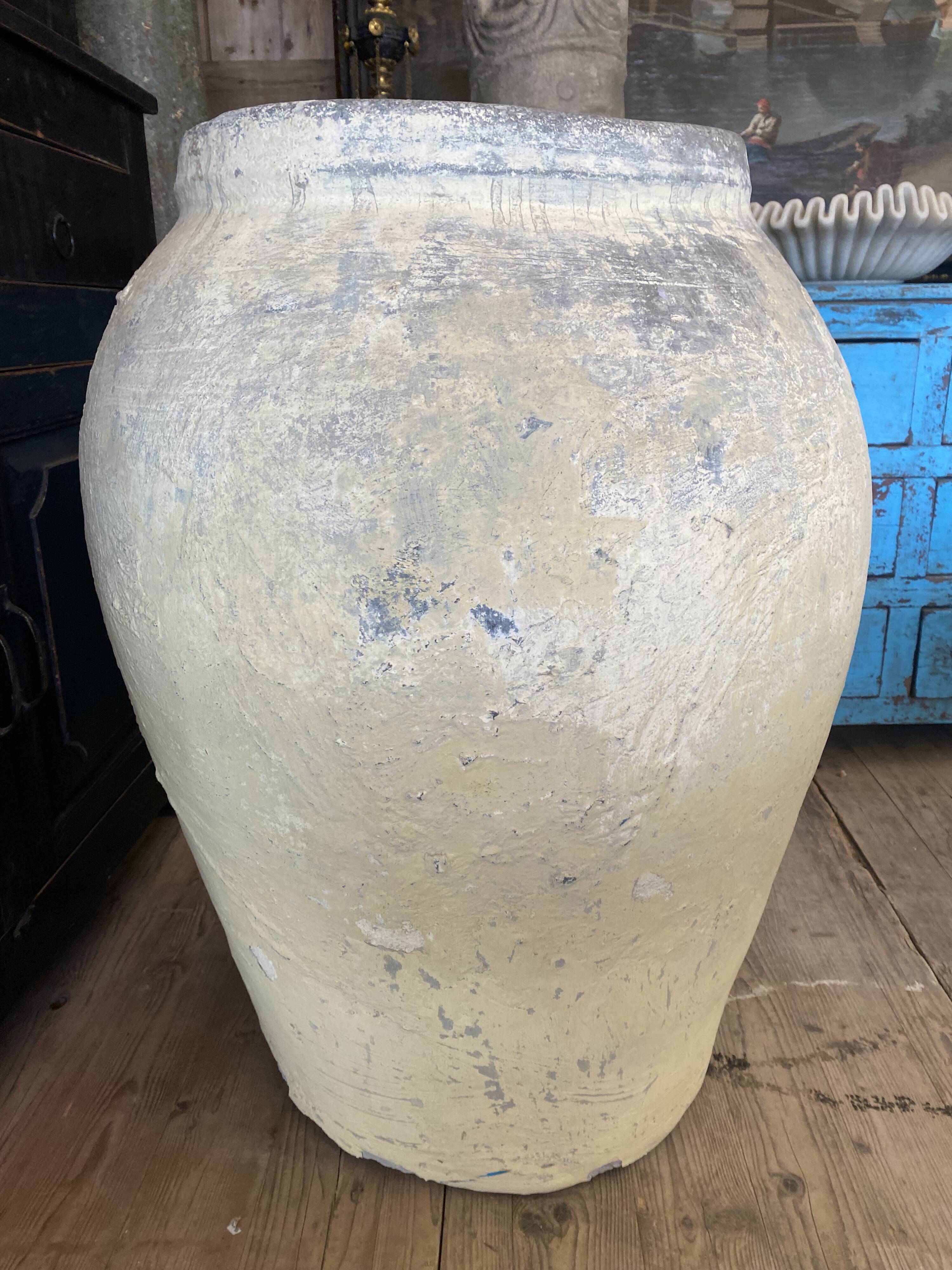 Yellow patinated cement grain jar