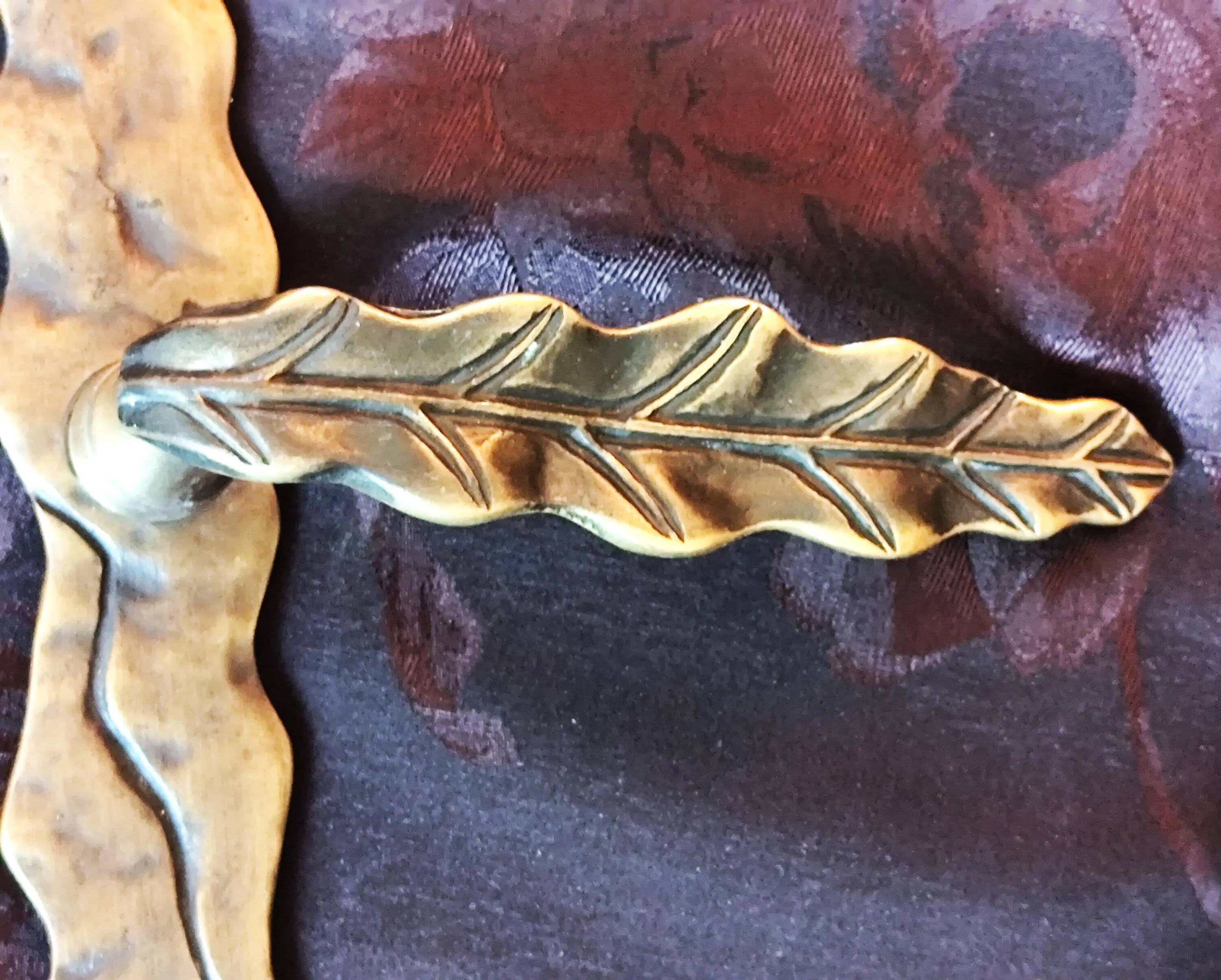 Pair of brass door handles with their cover plates