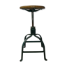 Old industrial stool in riveted and bolted metal