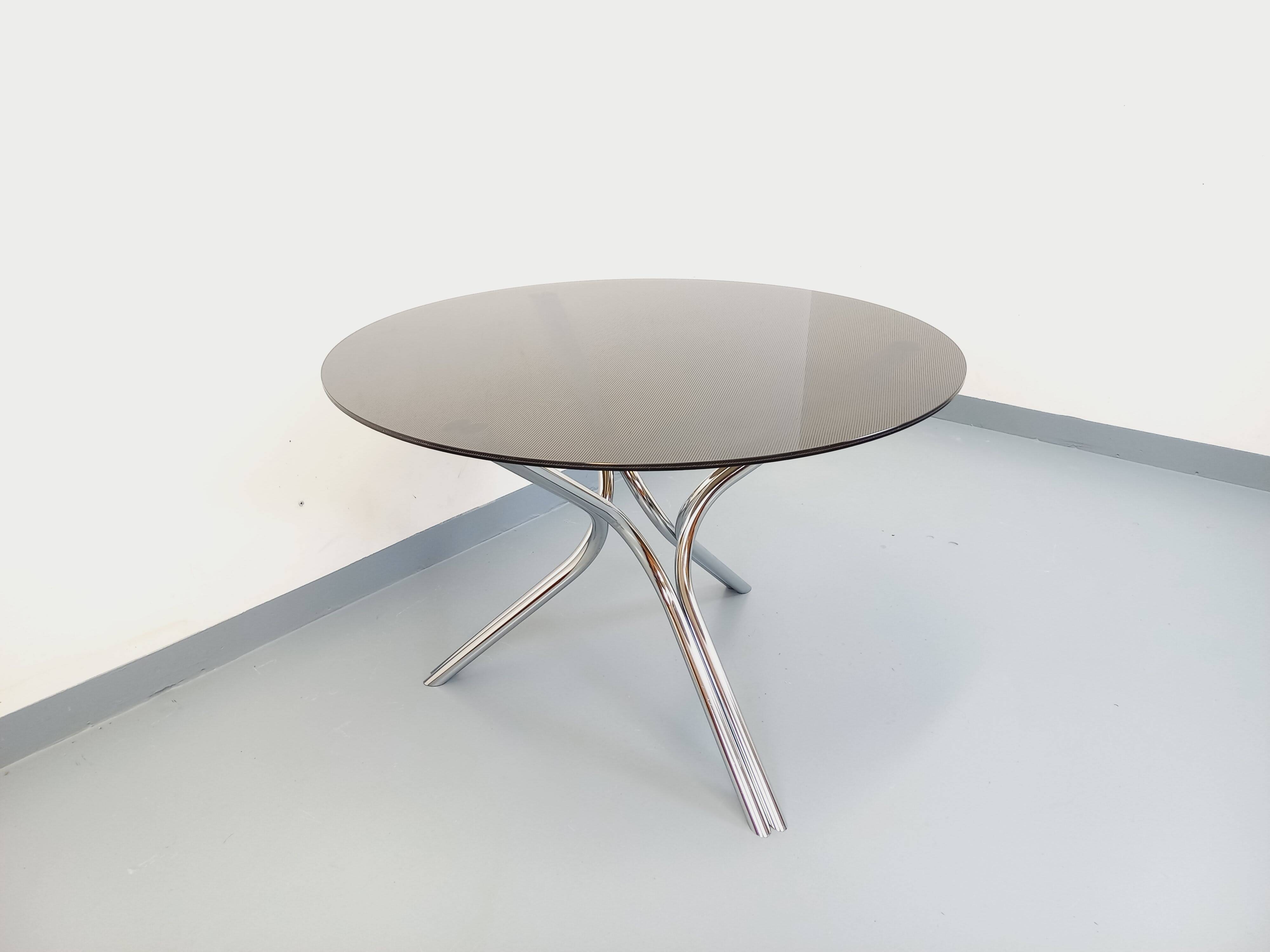 Vintage dining table in smoked glass plexiglass and chrome metal.