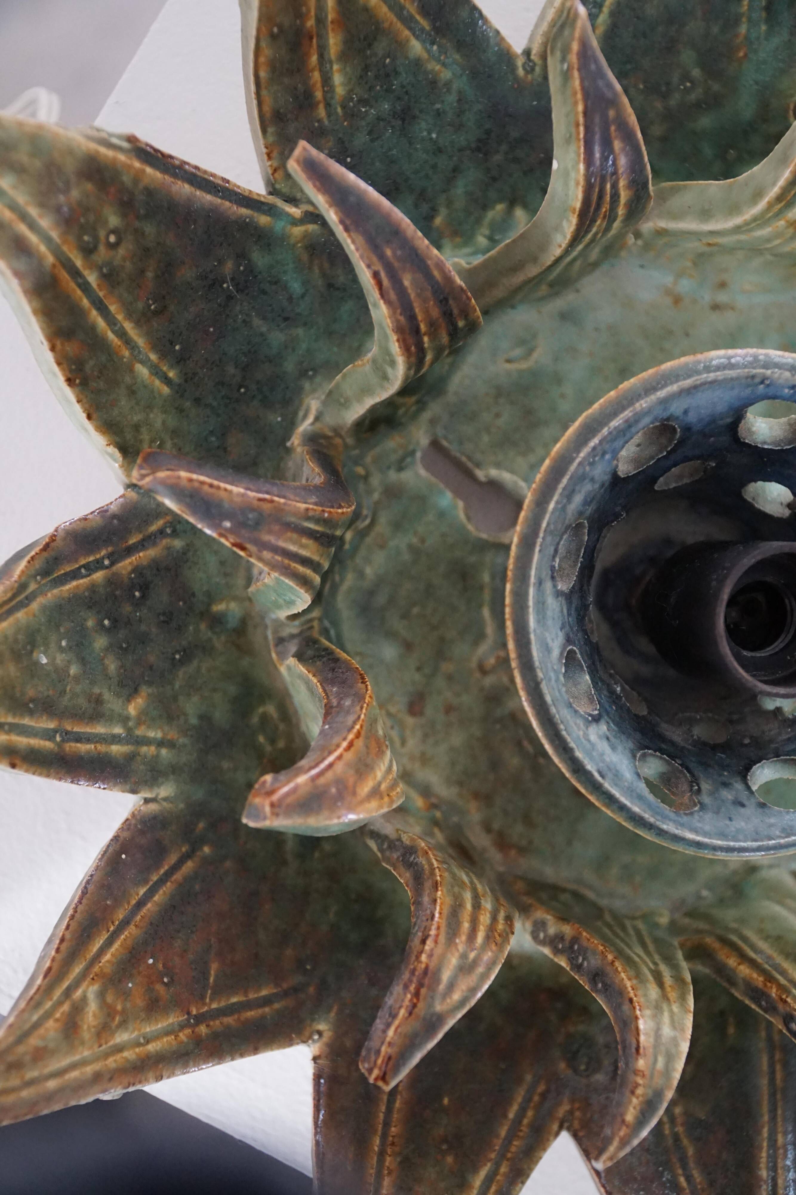 Mid-20th century ceramic sun wall lamp or decorative wall sculpture, 1960s.