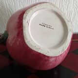 Pink pitcher in the shape of a strawberry, Italian slurry.