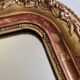 Miroir Louis-Philippe en bois et stuc doré à décor floral, XIXe, 43x38 cm