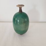Green pot-bellied ceramic vase with foot and high, narrow neck in signed raku