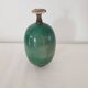 Green pot-bellied ceramic vase with foot and high, narrow neck in signed raku