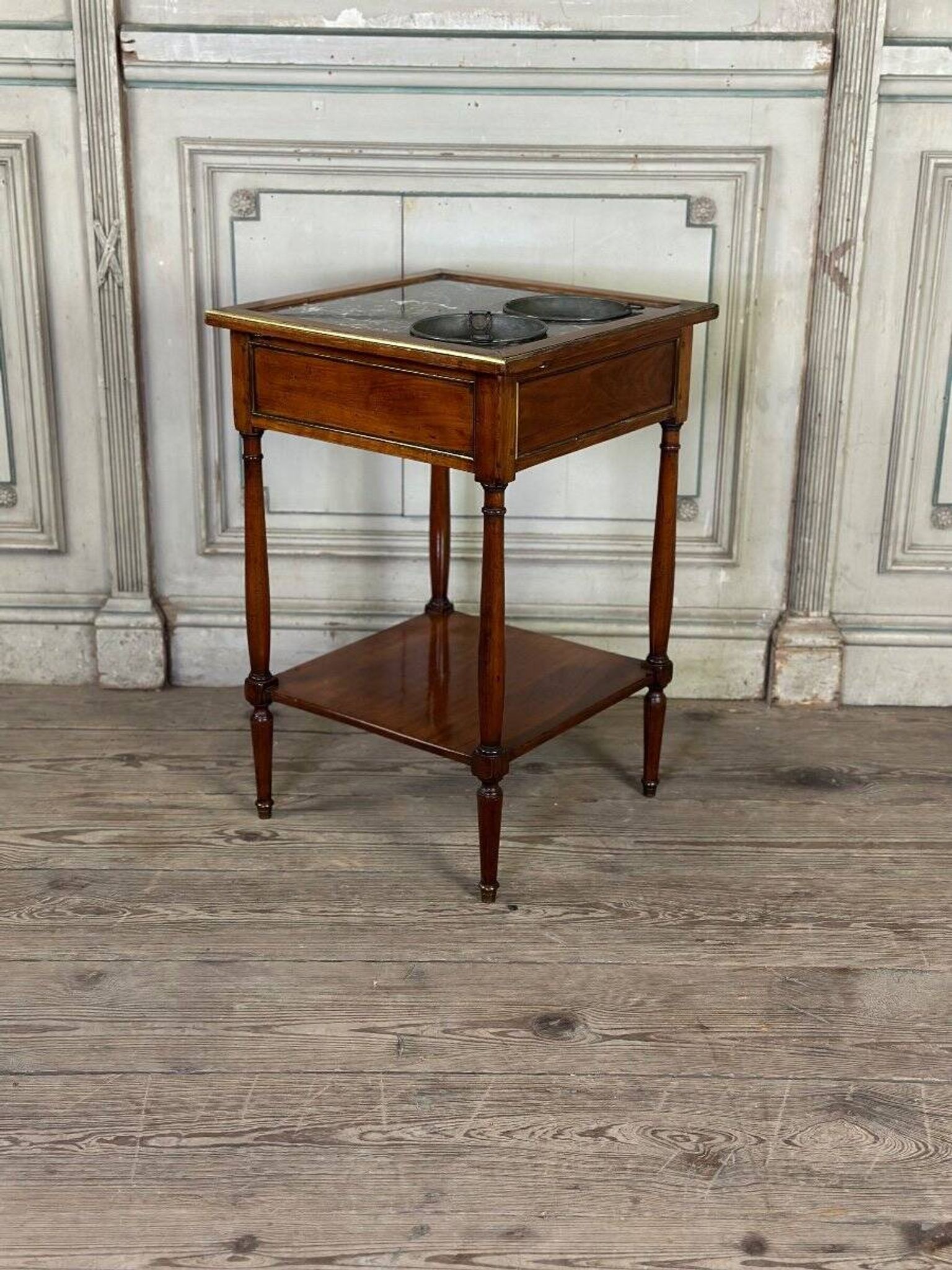Refreshment table in mahogany, grey marble top, two zinc buckets, 18th century.