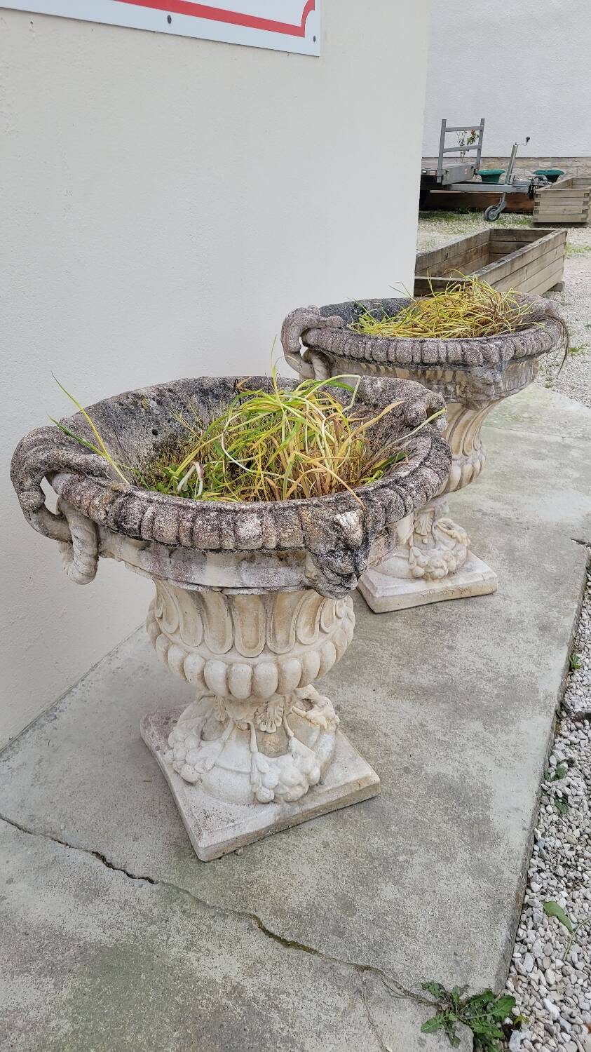 Pair of planter vases decorated with faces in reconstituted stone 1950s