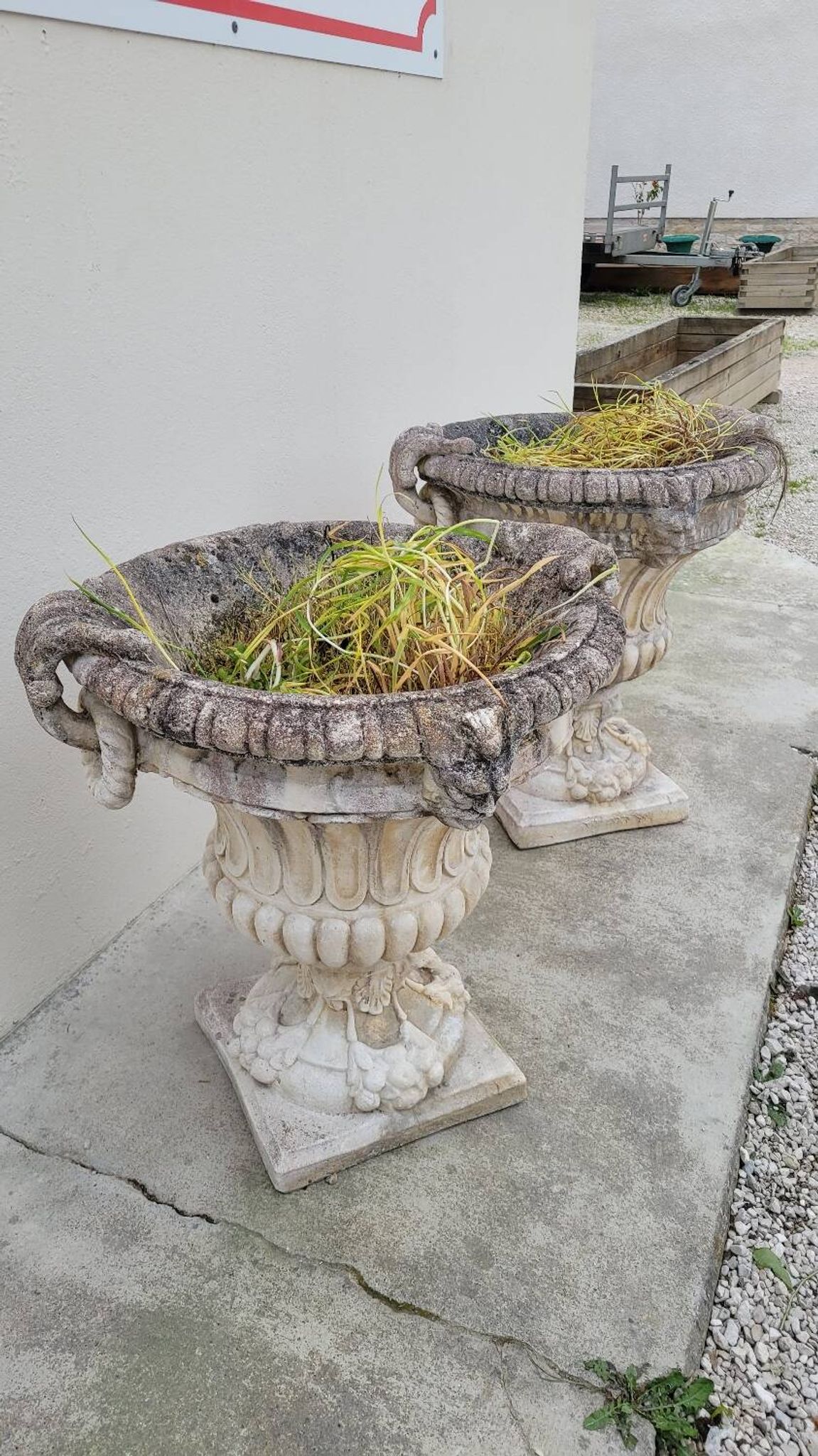 Pair of planter vases decorated with faces in reconstituted stone 1950s