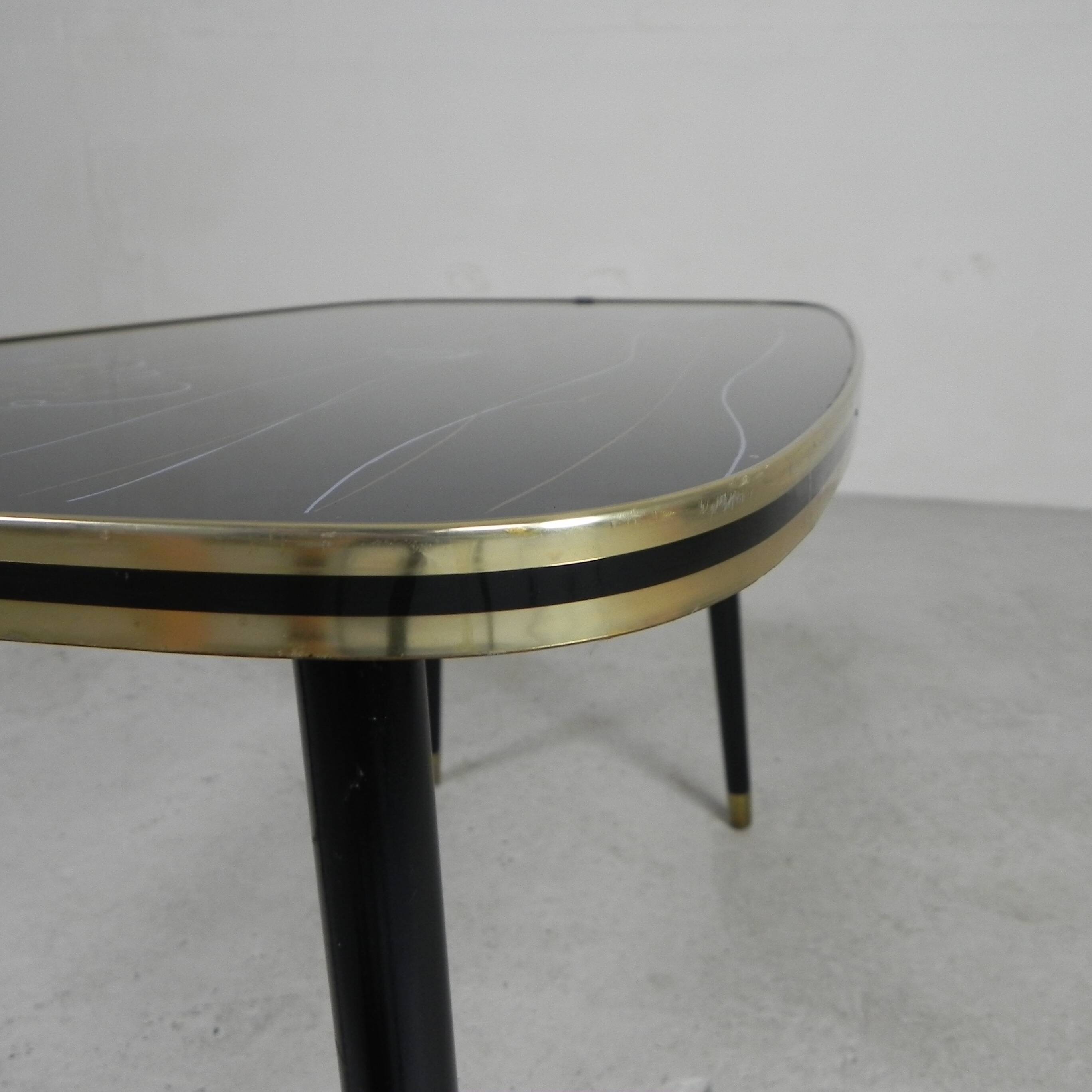 Vintage coffee table with glass top and angled legs