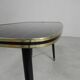 Vintage coffee table with glass top and angled legs