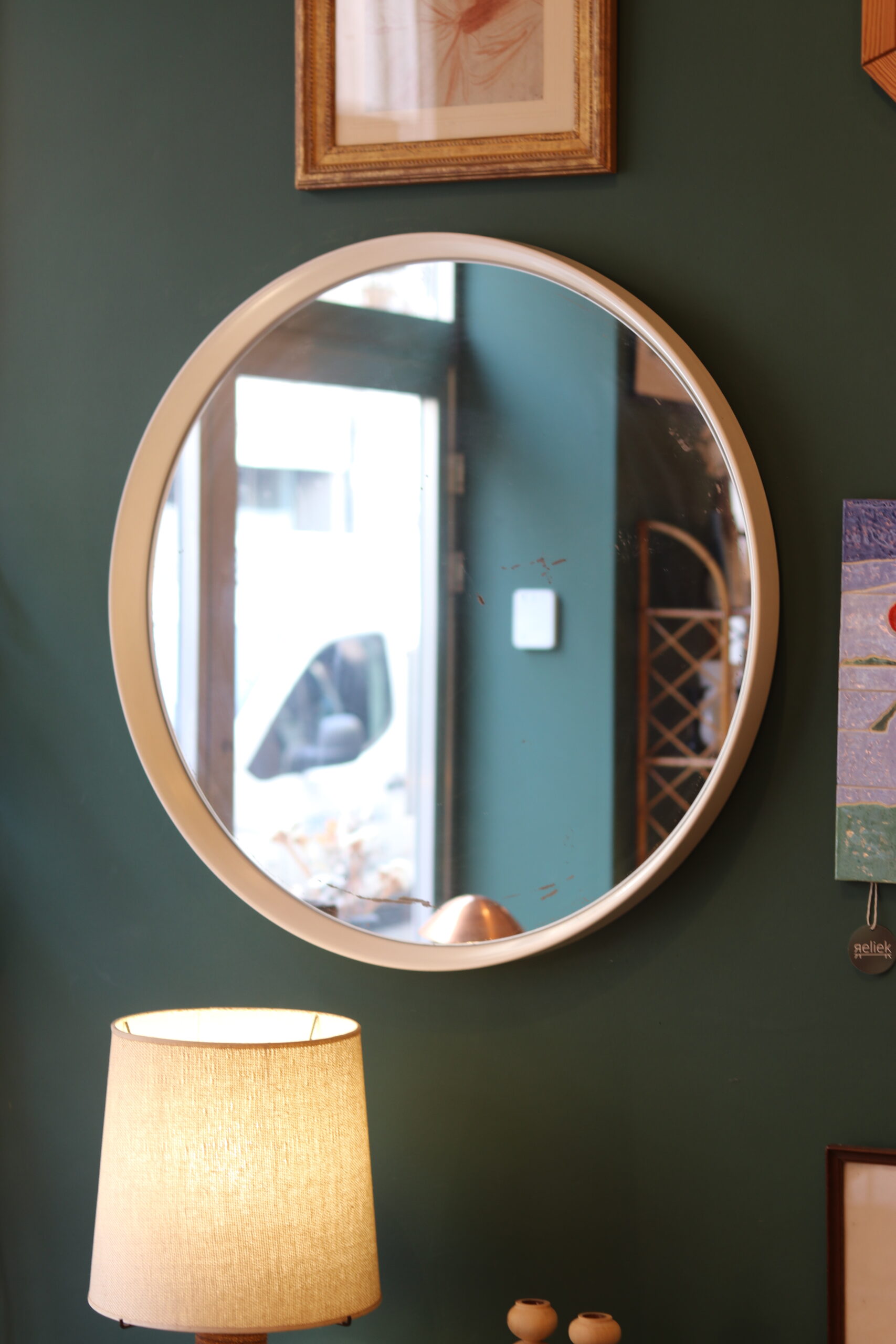 Large vintage circular mirror, plastic frame.