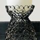 Handcrafted wrought iron lamp with a white opaline globe.