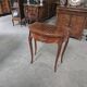 Half-moon gaming table in Louis XV style, made of precious wood marquetry.