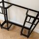 Antique black wrought iron coat rack with mirror.