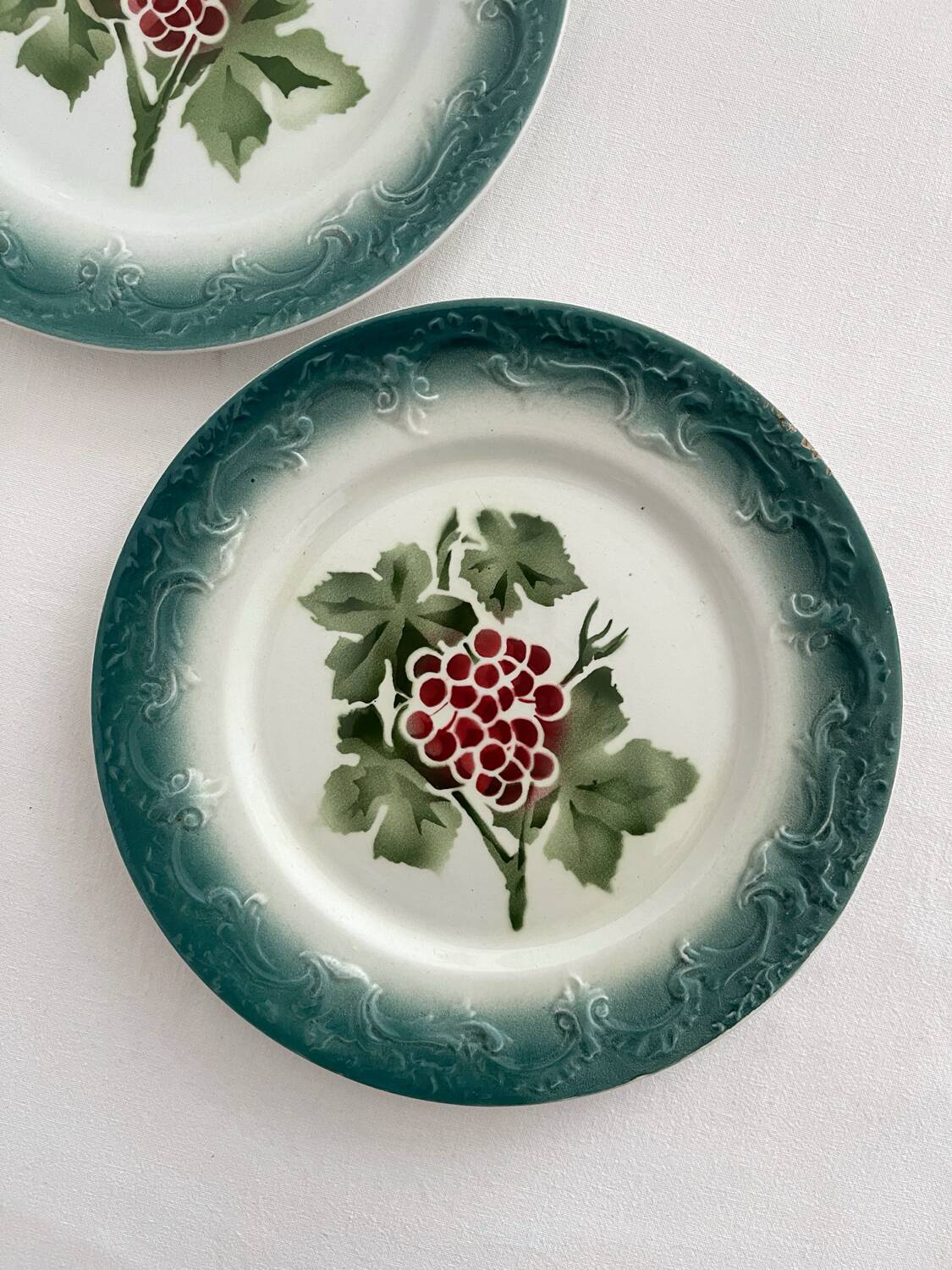 2 antique Pexonne earthenware dessert plates with grapes