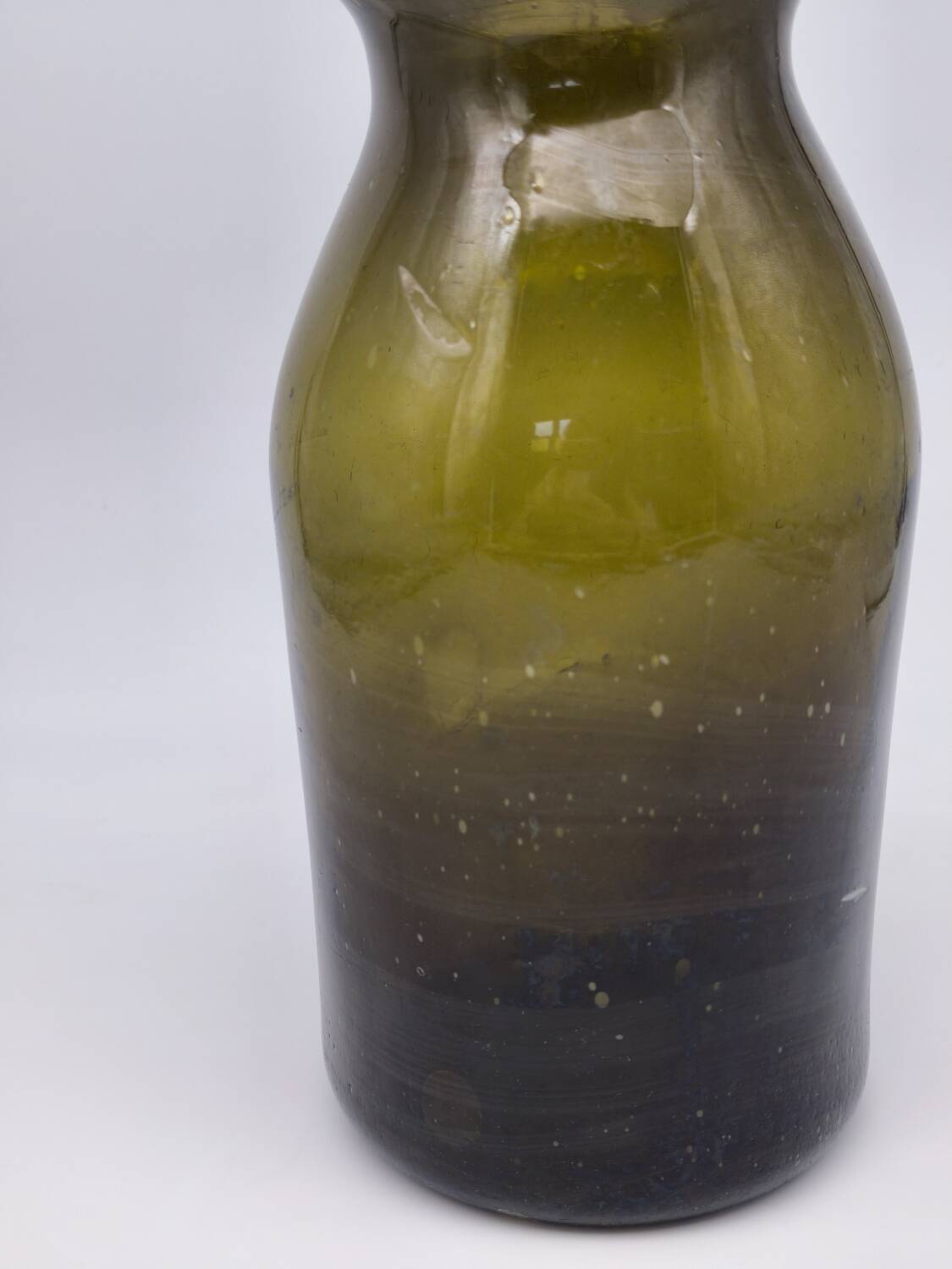 Old olive green blown glass mushroom jar, decorative object.