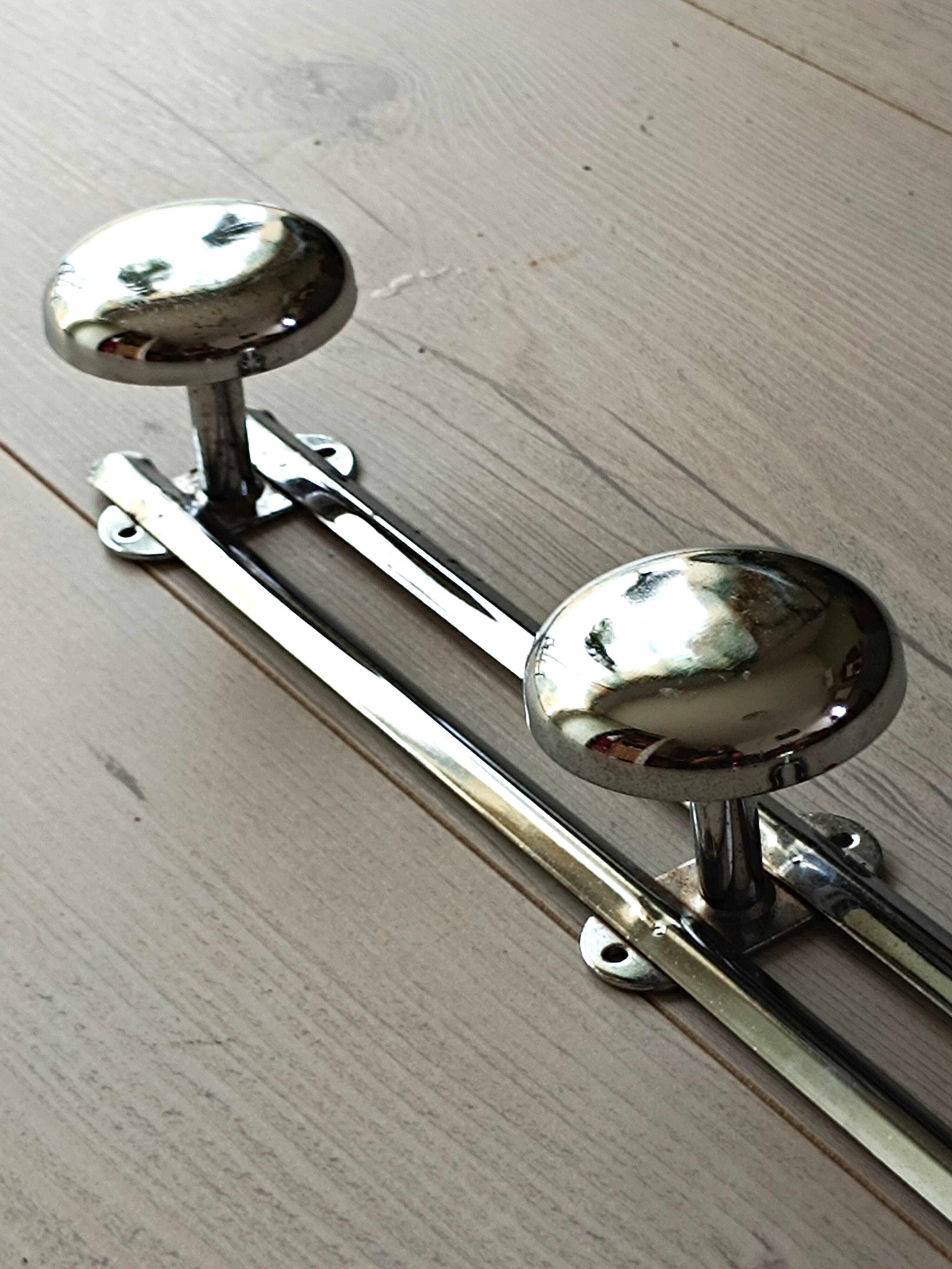 Chrome metal wall coat rack