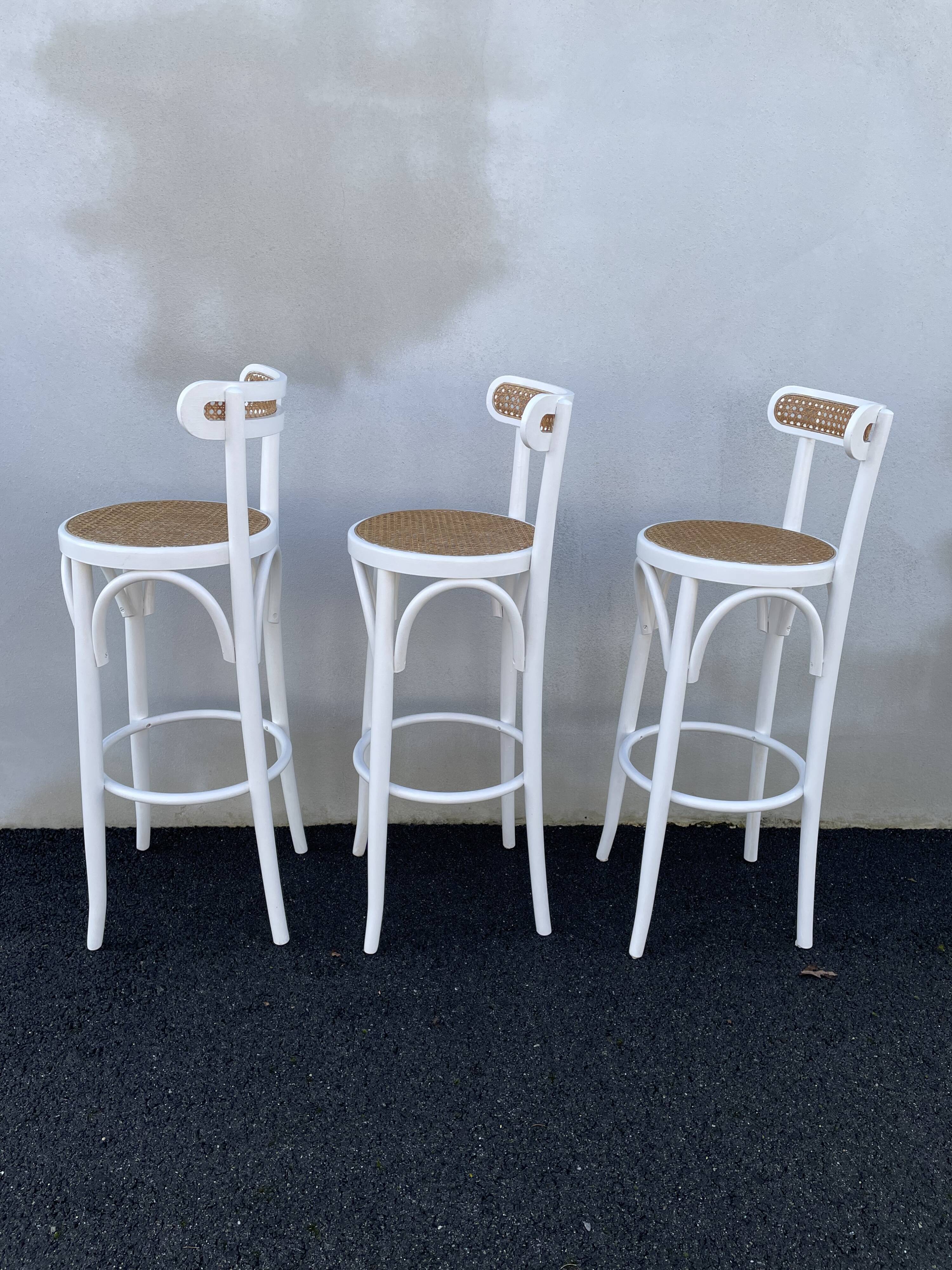 High stools in cane and curved wood 1970-1980