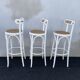 High stools in cane and curved wood 1970-1980