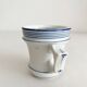 Antique porcelain teacup with blue rims, 19th century