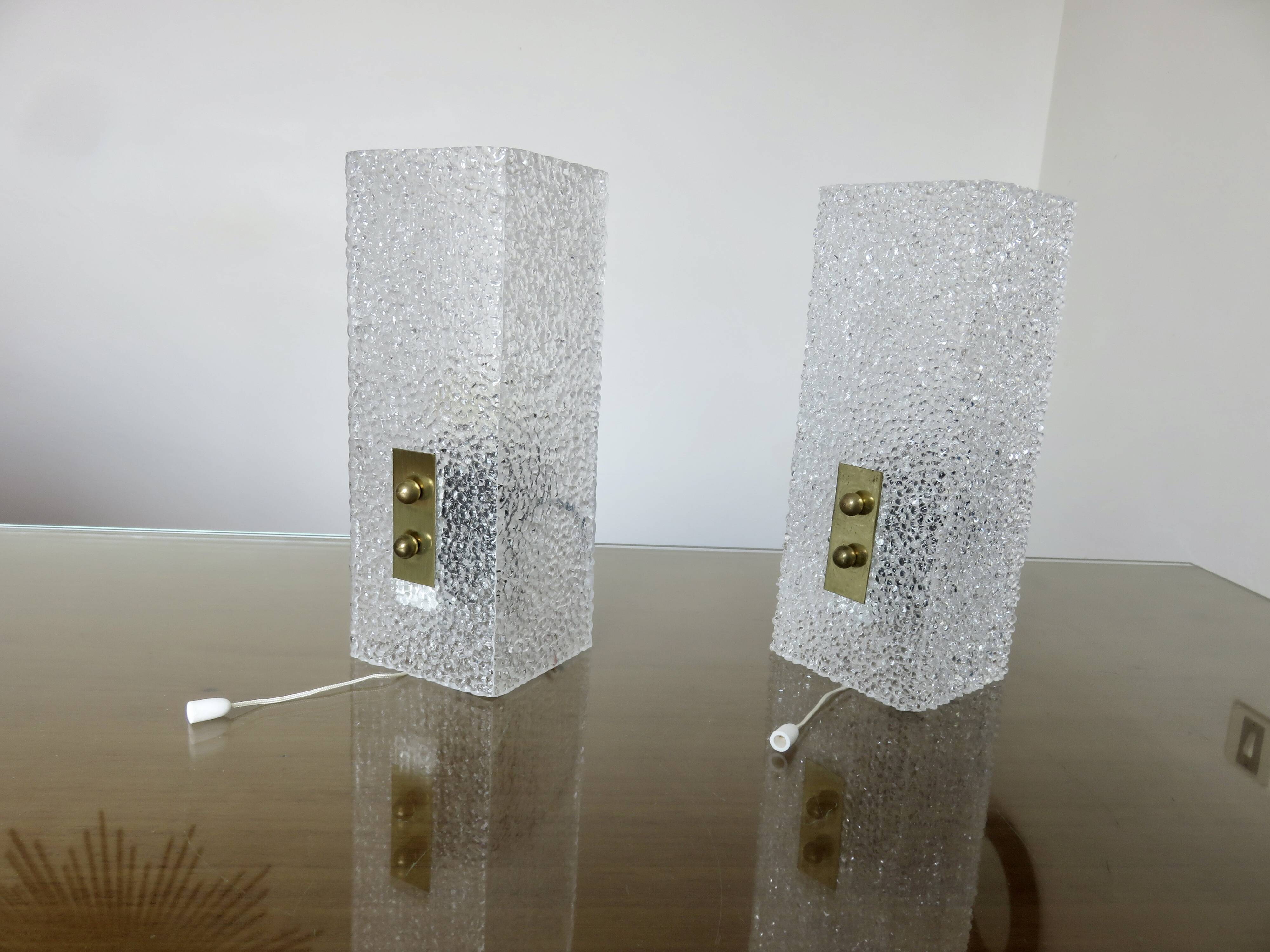 Pair of pull switch wall lights in perspex and gilded brass, France, circa 1960.