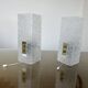 Pair of pull switch wall lights in perspex and gilded brass, France, circa 1960.