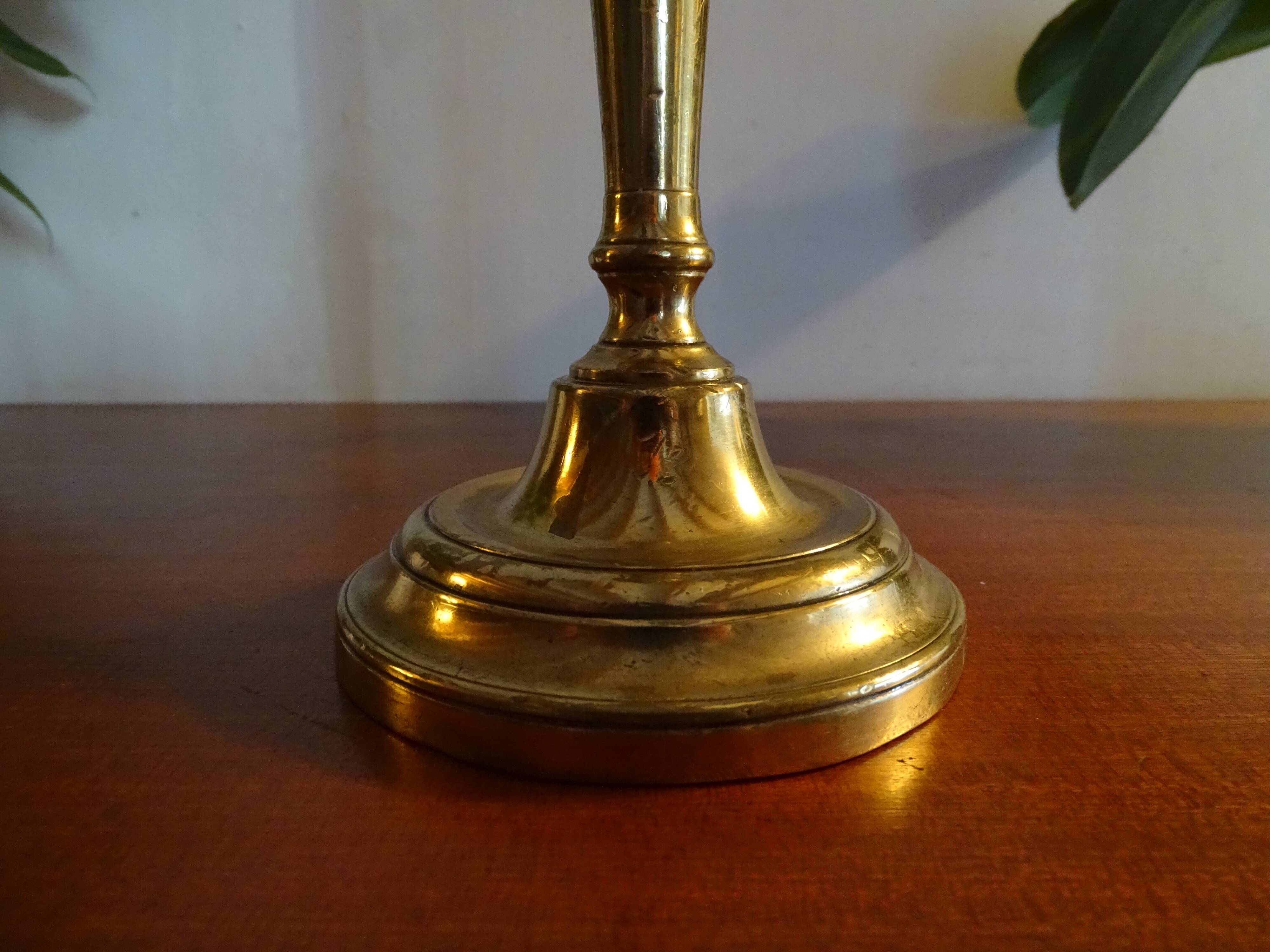 Old brass candle holder and its candle 21.5 cm