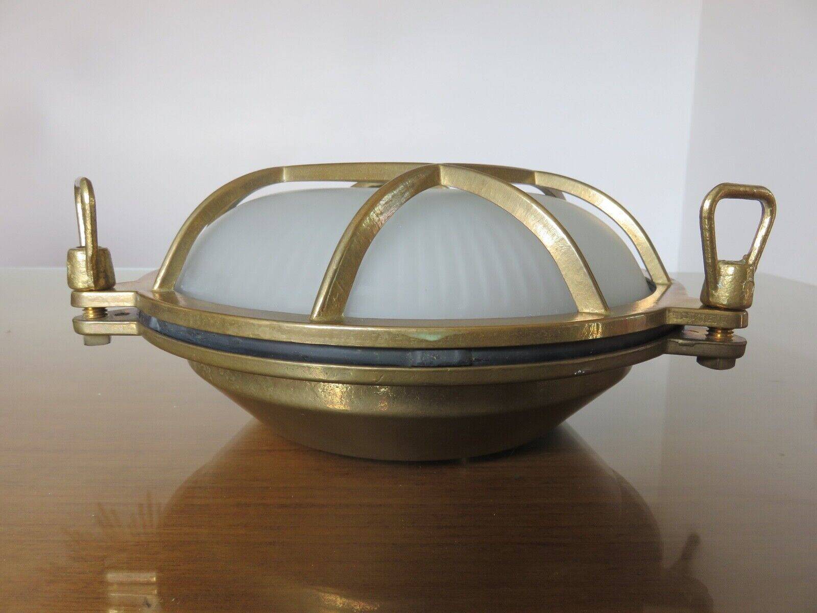 Brass porthole wall lamp