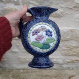 Blue ceramic vase with floral motifs