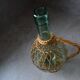 Bouteille verre et rotin vintage
