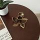 Vintage flower candlestick in solid gold brass
