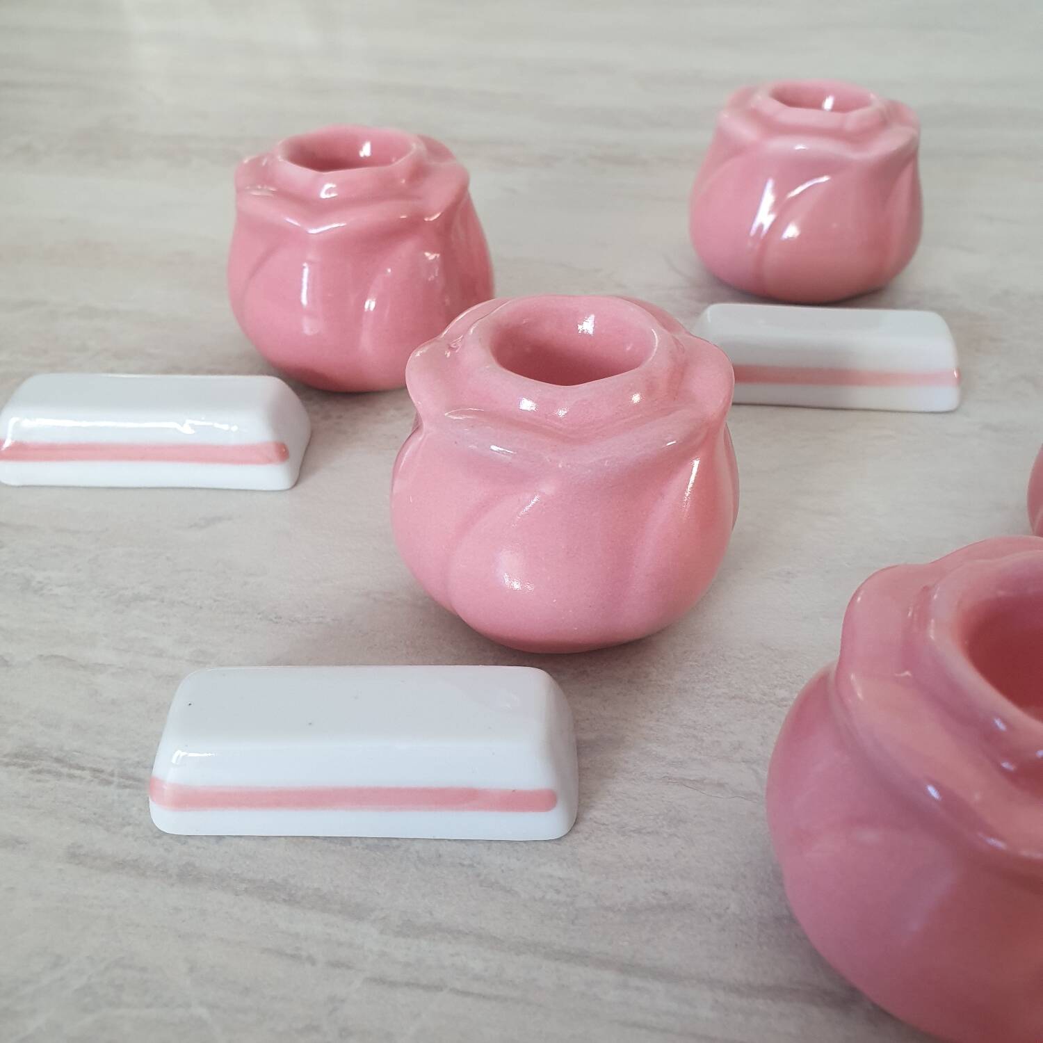 Pink candlesticks and porcelain knife holders