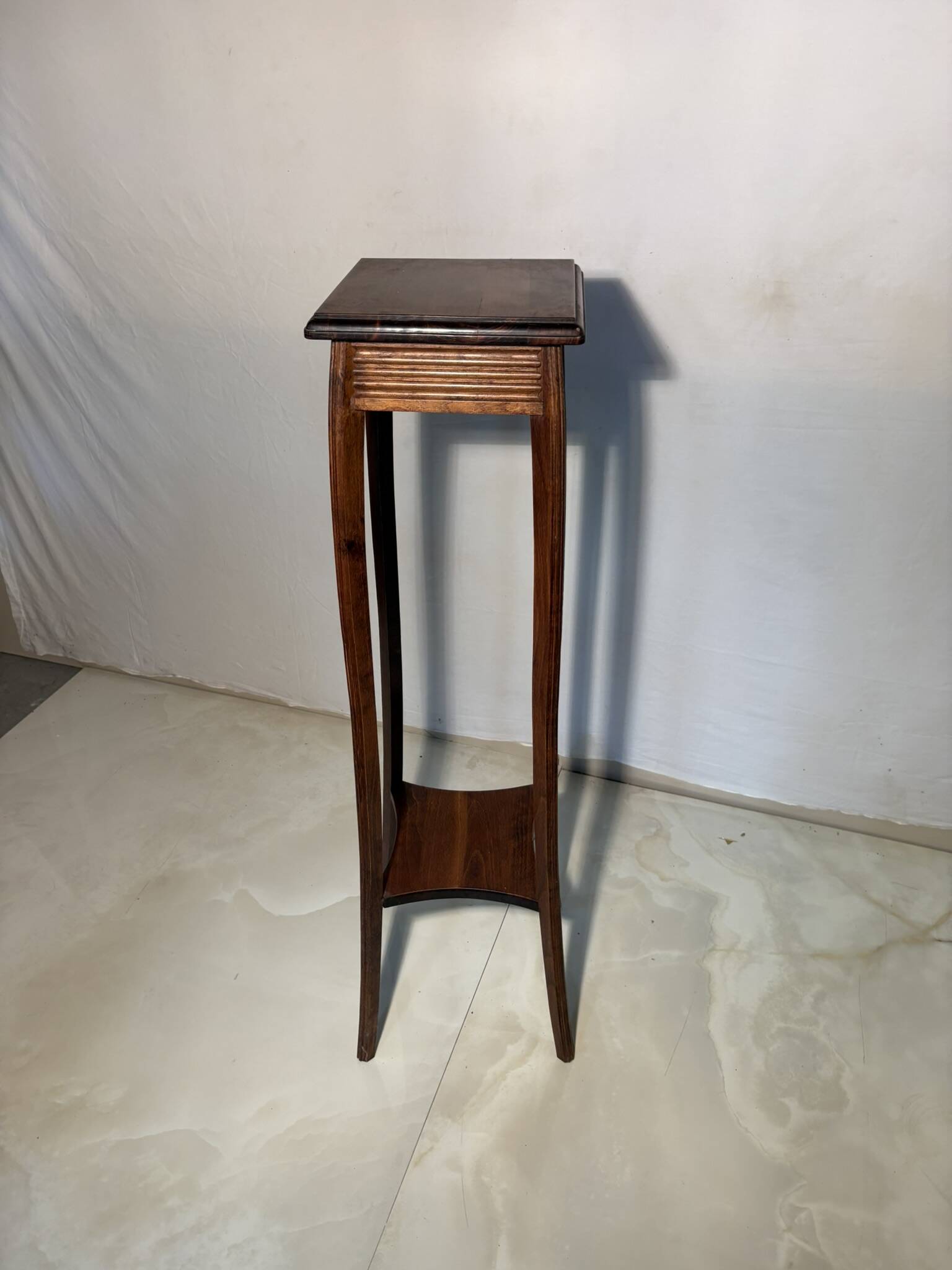 Vintage dark wood side table with curved base
