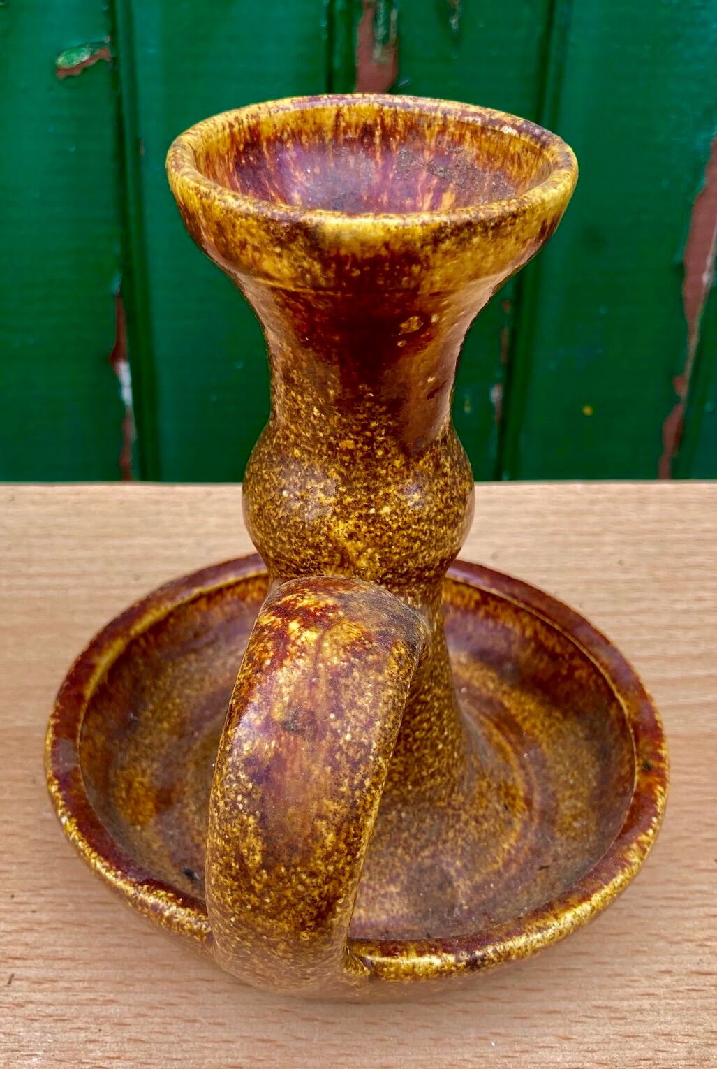 Candle holder in old earthenware signed by the 2 glued aa of the Accolay factory