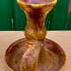 Candle holder in old earthenware signed by the 2 glued aa of the Accolay factory
