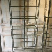 Pair of wrought iron and glass bookshelf shelves.