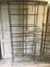 Pair of wrought iron and glass bookshelf shelves.