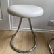Pair of vintage Z low stools with chrome metal base and white skai seat. H: 49 cm 80s