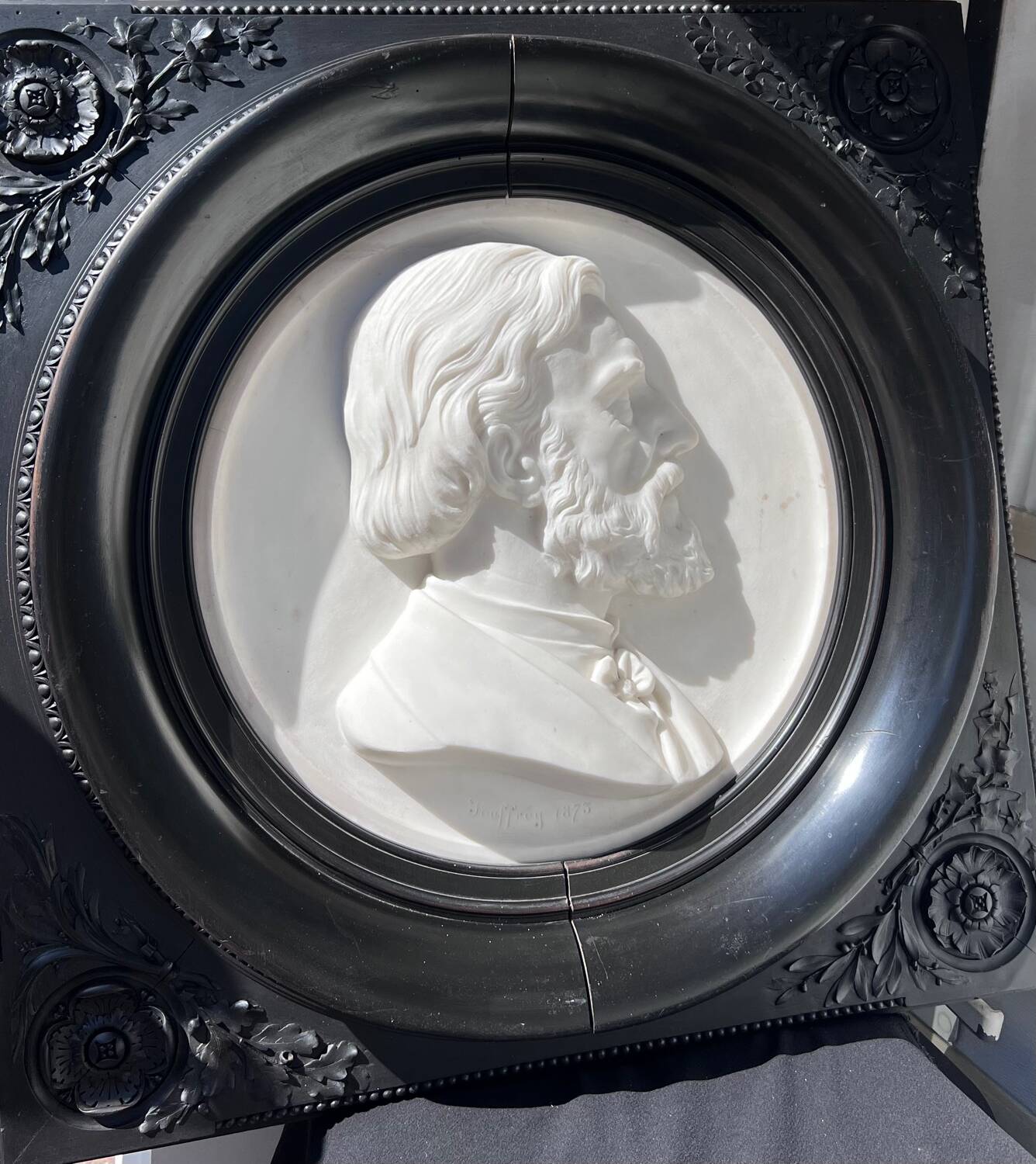 Bas-relief in marble and carved ebony signed Jouffroy, 1873