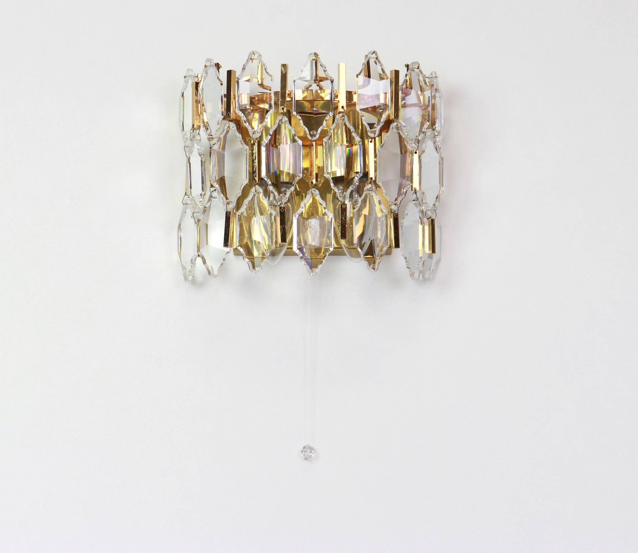 Pair of wall sconces in gilded brass and crystal by Palwa, Germany, 1970s.