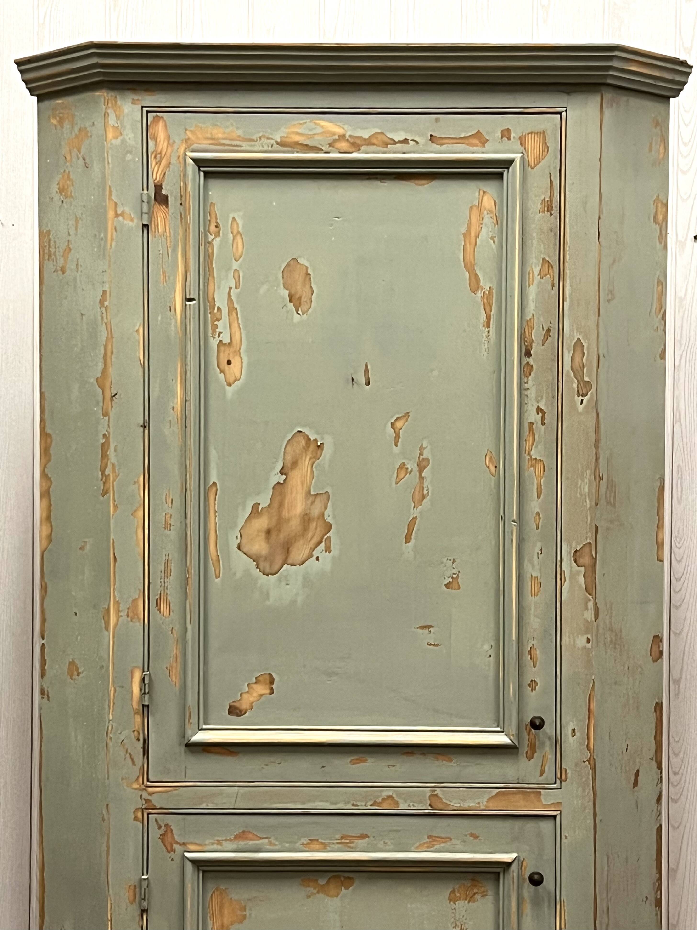 Patinated corner cupboard