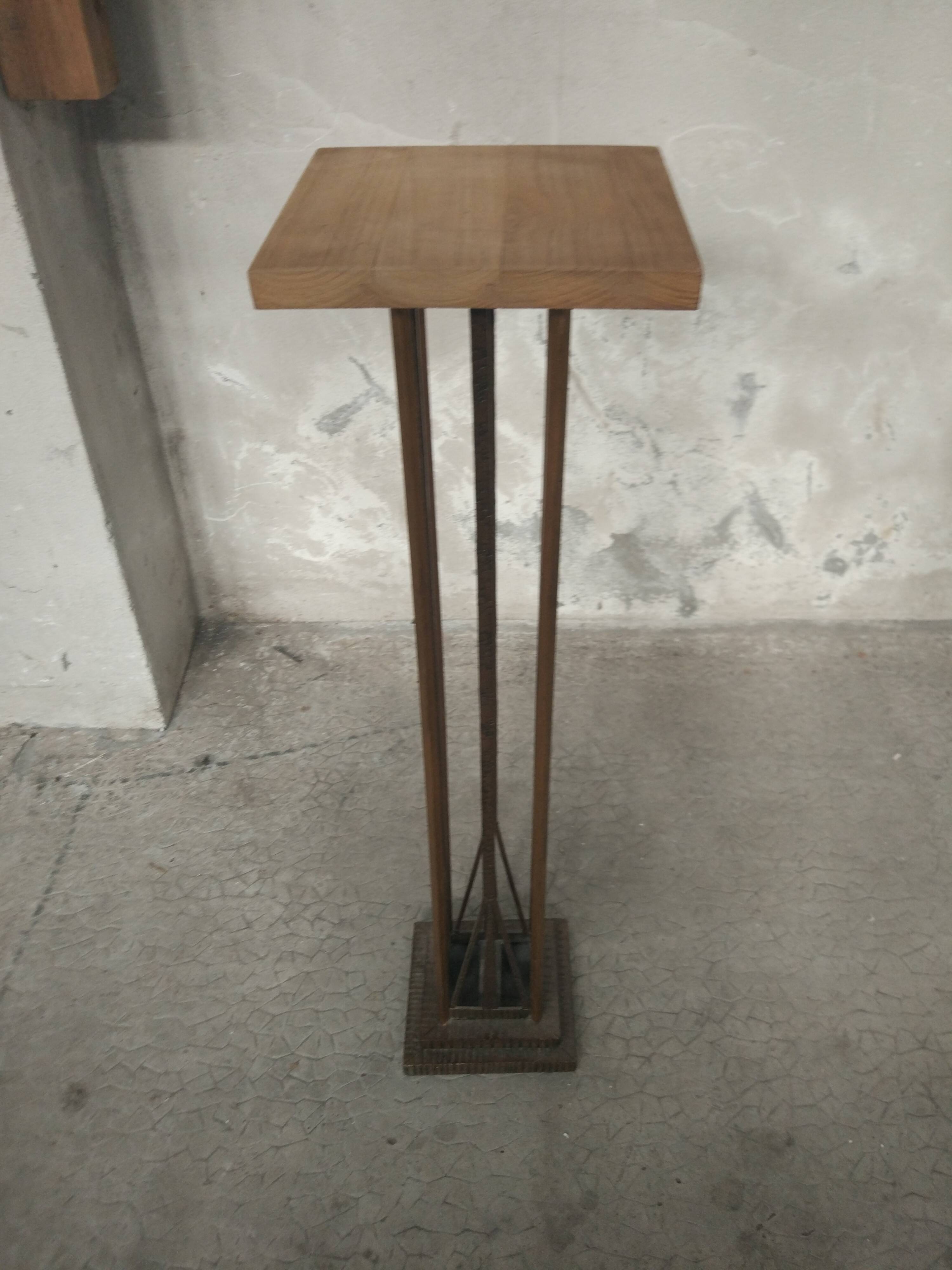 Column 1930 with one foot in wrought iron