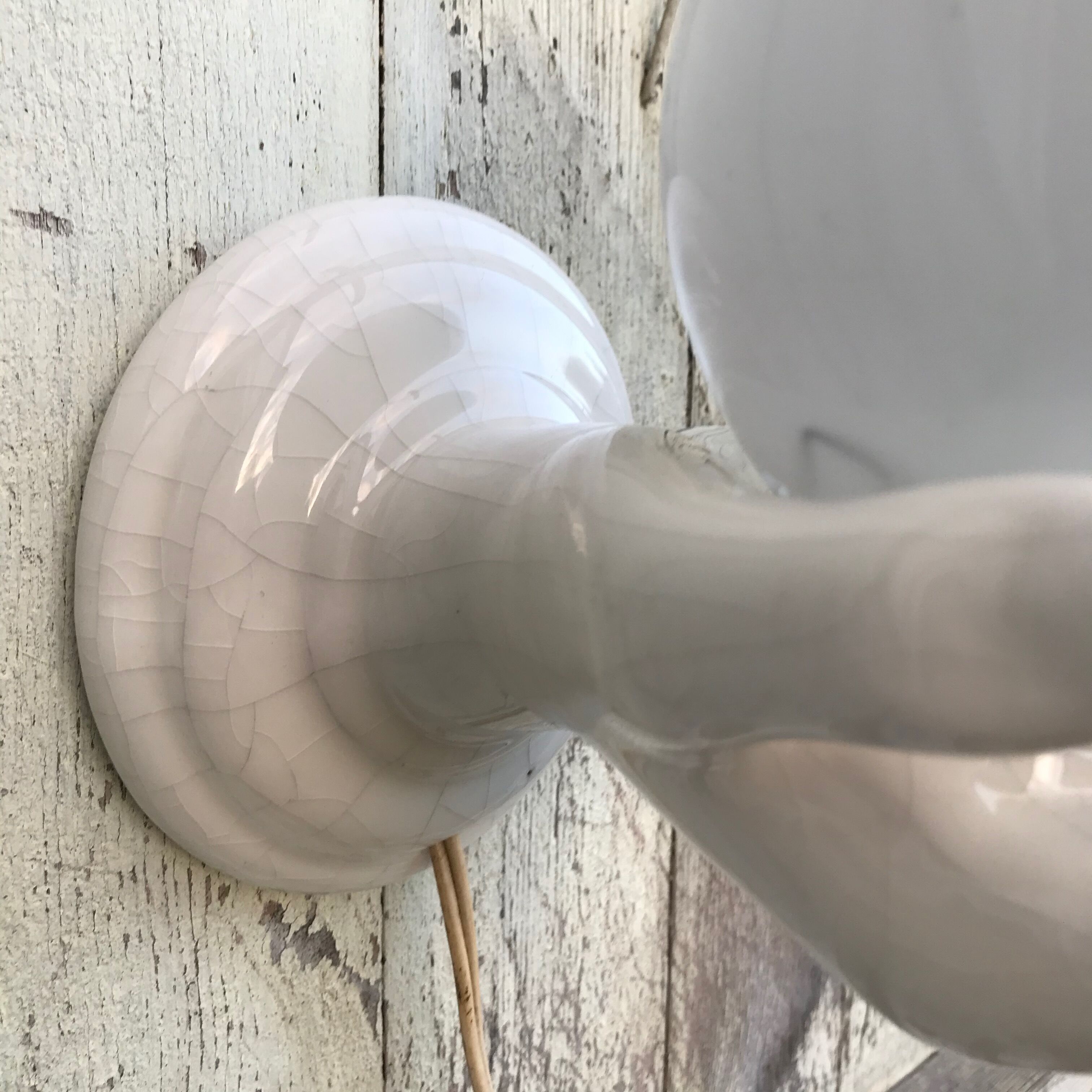 Hand-shaped ceramic wall light