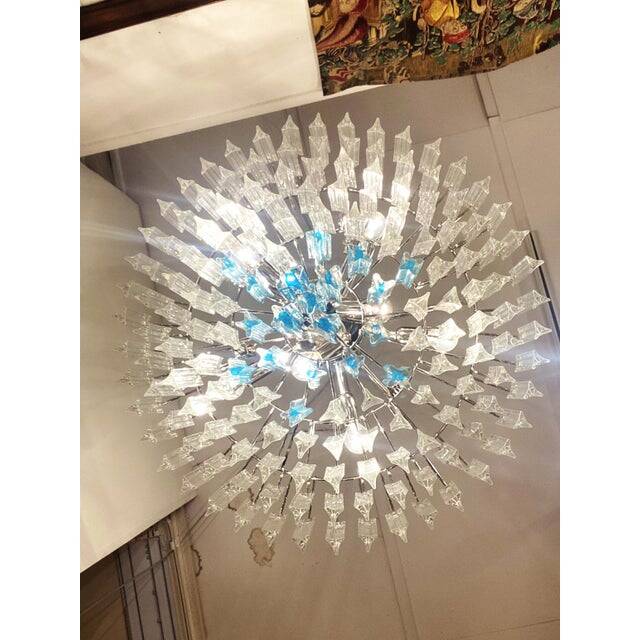 Contemporary transparent and ligh-blue triedro murano glass chandelier