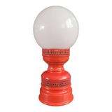 Vintage globe lamp with a metal base, perforated and lacquered in red.