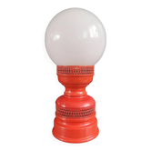 Vintage globe lamp with a metal base, perforated and lacquered in red.