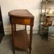 Cherry half-moon console with drawer and bottom shelf