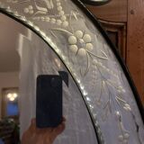 Oval Venetian mirror with close-bezel, early 20th century, flower decoration