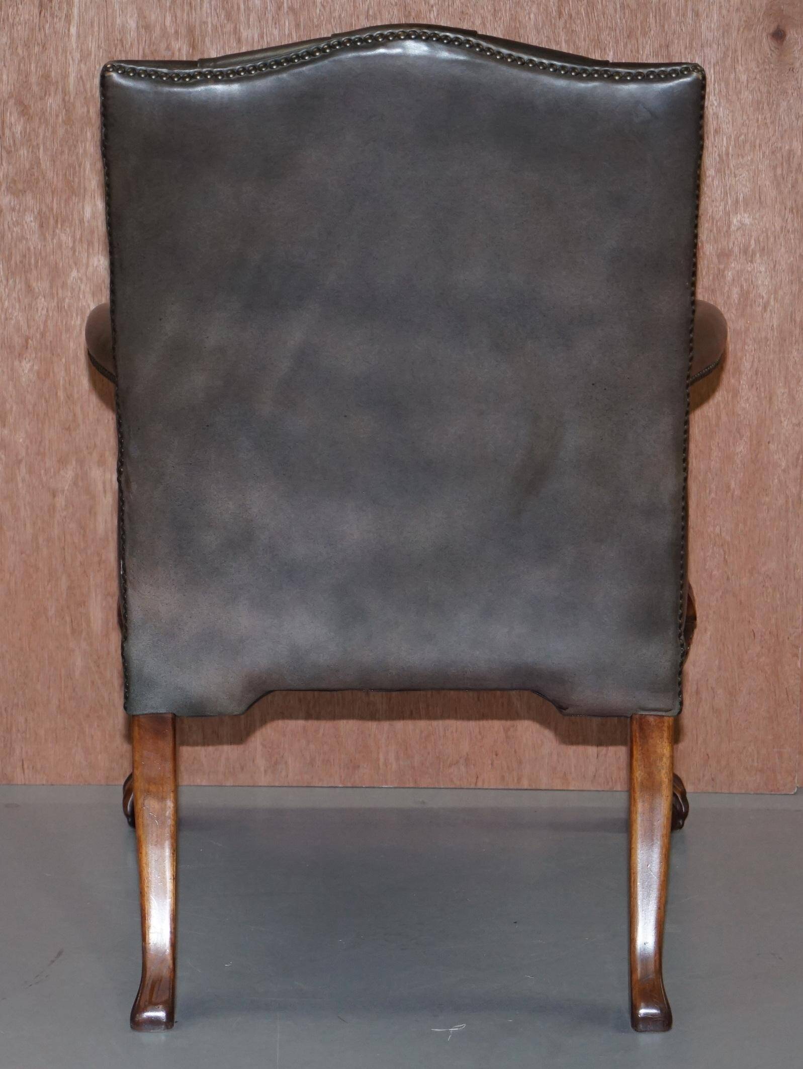 Gainsborough armchair George II leather Chesterfield hand-carved with claw and ball feet.