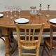 Oak dining table, oval living room table with two extensions.